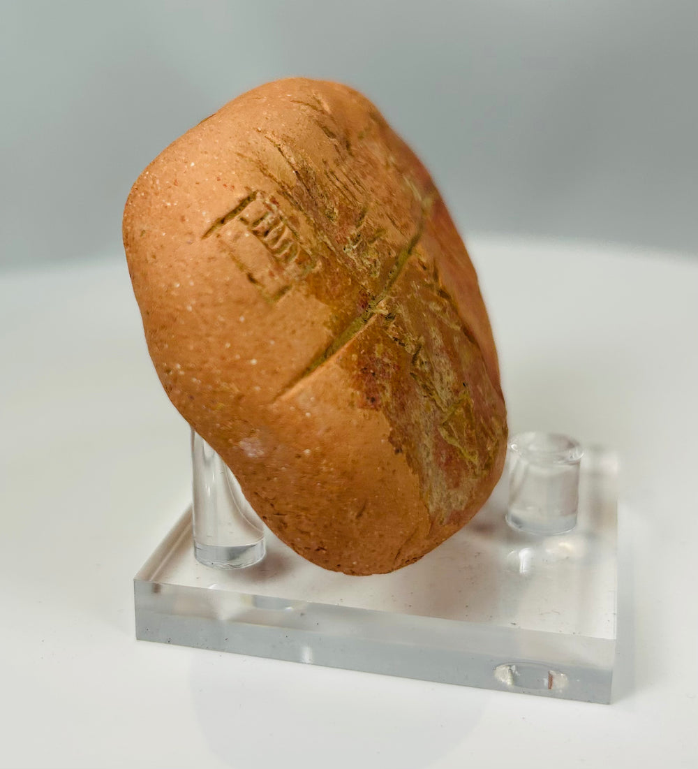 Early writing tablet with wedge shaped symbols and patina