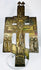 Cast bronze Russian Orthodox cross icon with multiple saintly figures and centuries-old patina.