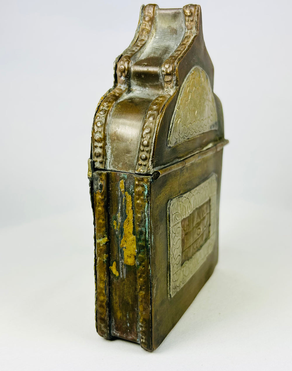 19th century Islamic talismanic amulet box from Morocco, repoussé brass with symbolic geometric designs.