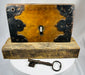 Vintage door lock with skeleton key and decorative iron corners