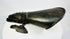 Close-up of 19th-century armour gauntlet reproduction displayed on white studio backdrop.