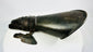Close-up of 19th-century armour gauntlet reproduction displayed on white studio backdrop.
