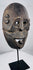Historic Indonesian ceremonial mask from Fatuleu Village exhibiting distinctive carved facial features and natural aged wear.