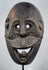West Timor ceremonial mask hand-carved from hardwood with expressive simian features and aged patina.