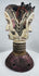 Mid-20th century Nigerian dance crest displaying two opposing human faces and traditional masquerade artistry.