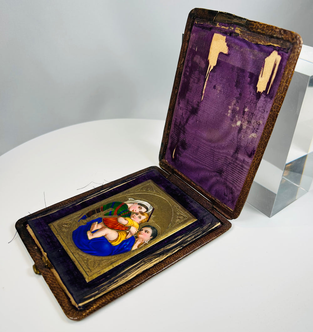 Polychrome enamel Madonna and Child icon with ornate border