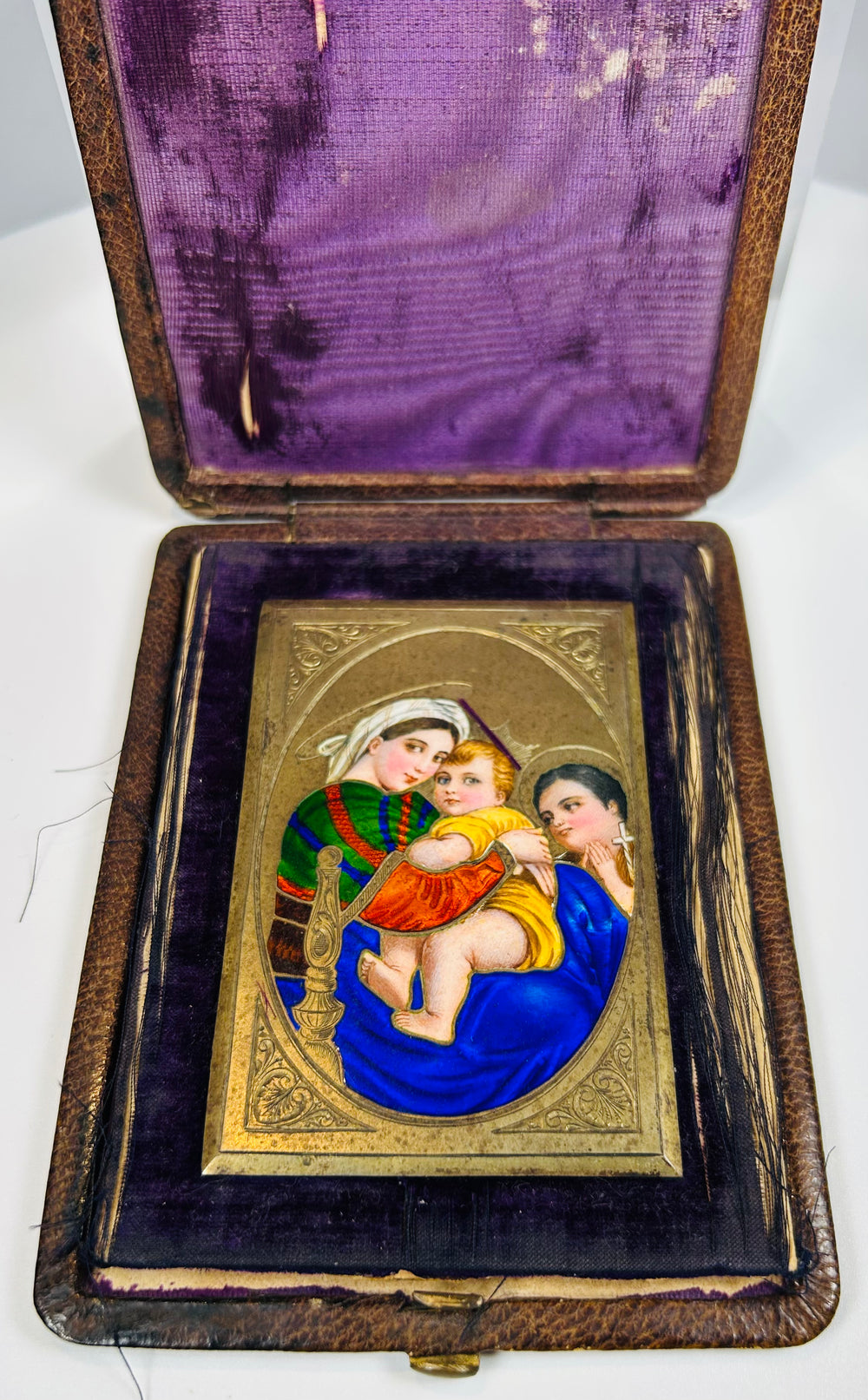 Vintage enamel plaque depicting Madonna and Child with attendant