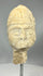 Assyrian carved stone head mounted on marble display base