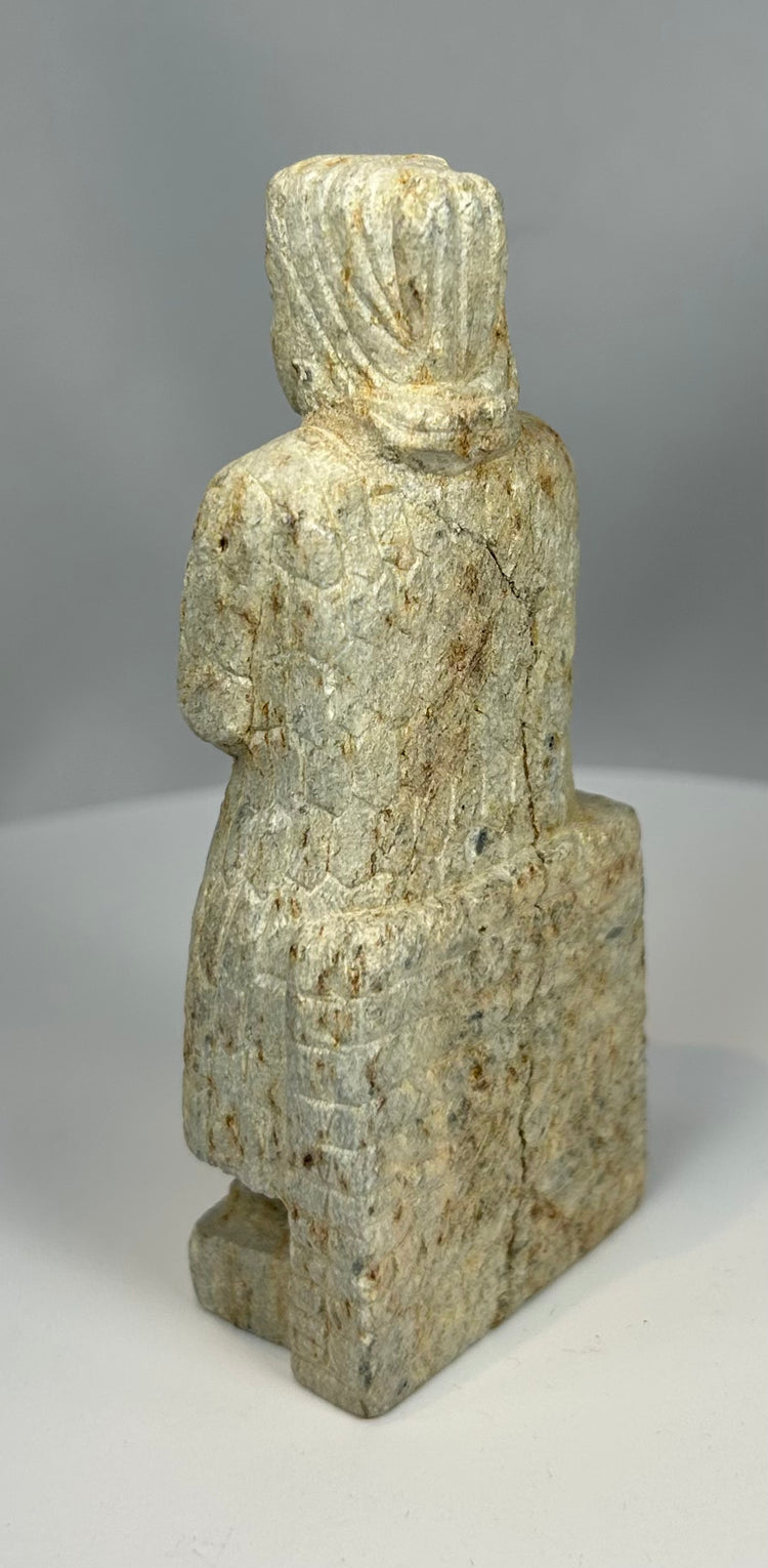 Ancient Near Eastern devotional sculpture with simplified form