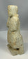 Stone figurine from Mesopotamia with stylized facial features