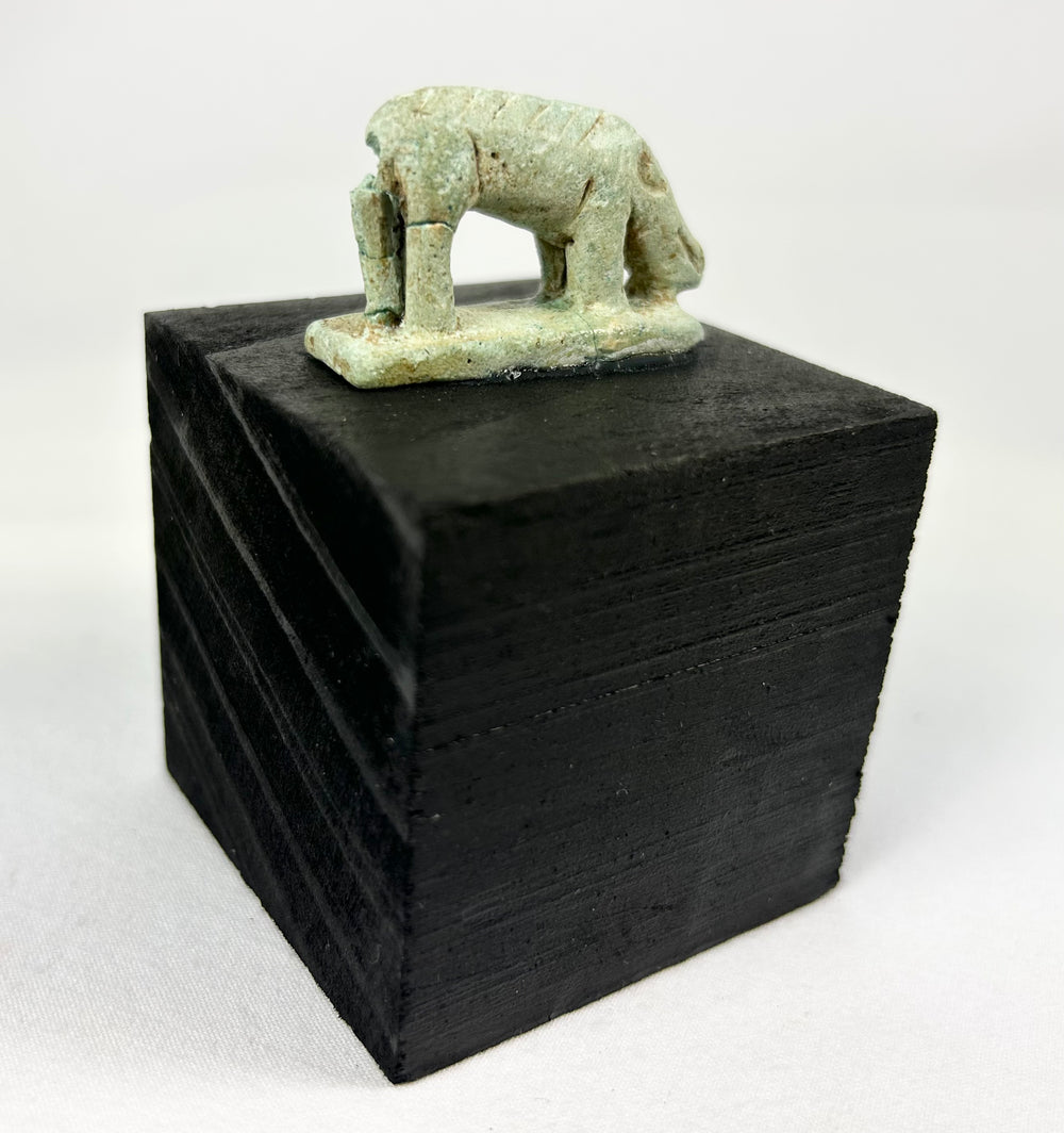 Ptolemaic era Egyptian shrew votive figure, faience with weathered glaze and ancient break through plinth.