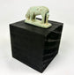 Ancient Egyptian protective shrew amulet, 664–30 BCE, pale green faience with burial wear.