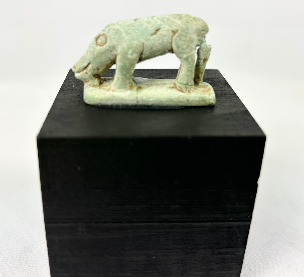 Egyptian faience shrew figurine, Late Period–Ptolemaic, mounted on modern black display block.