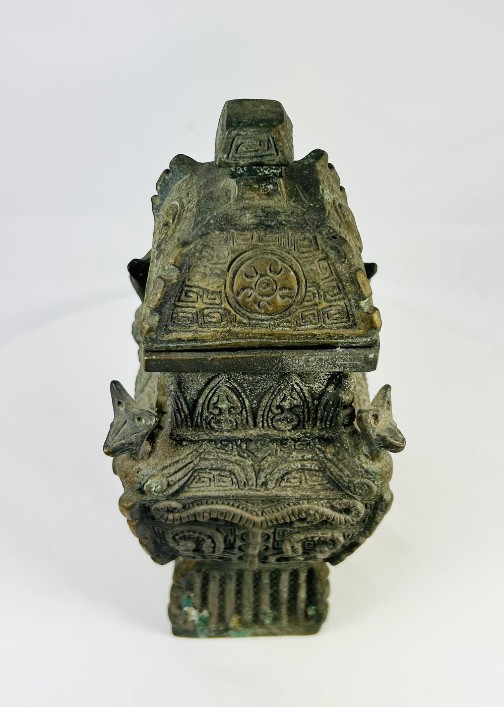 Chinese revival bronze altar vessel, roof-lidded fang yi form with zoomorphic shoulder details and dark patina.