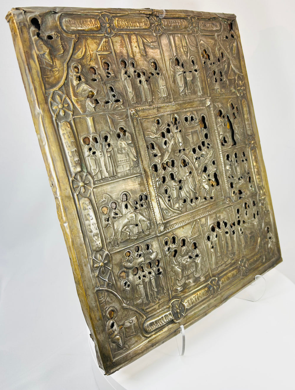 19th century Russian icon with pierced metal covering revealing sacred figures beneath