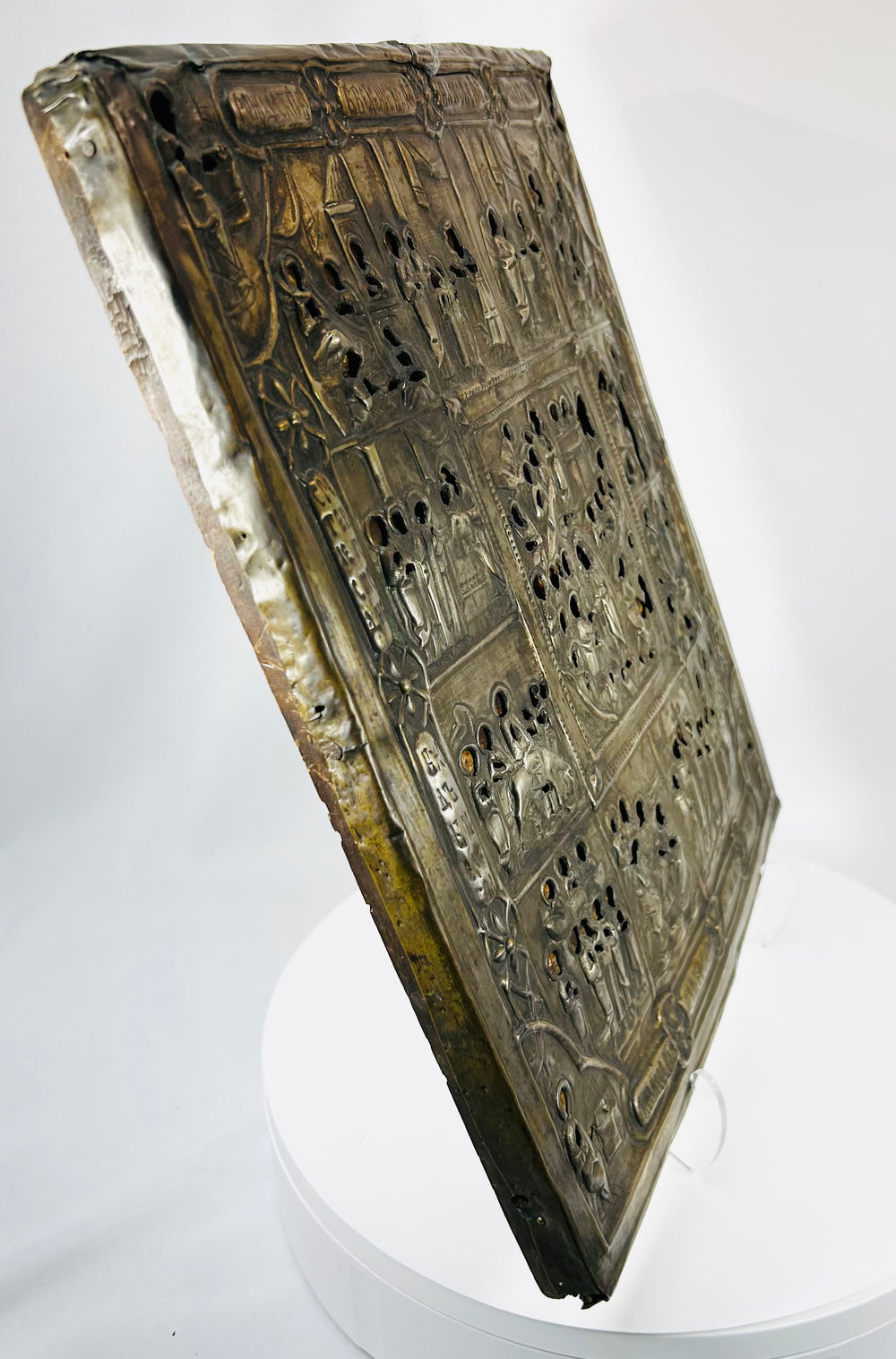 Antique Russian icon with multi-panel narrative design and aged metal patina