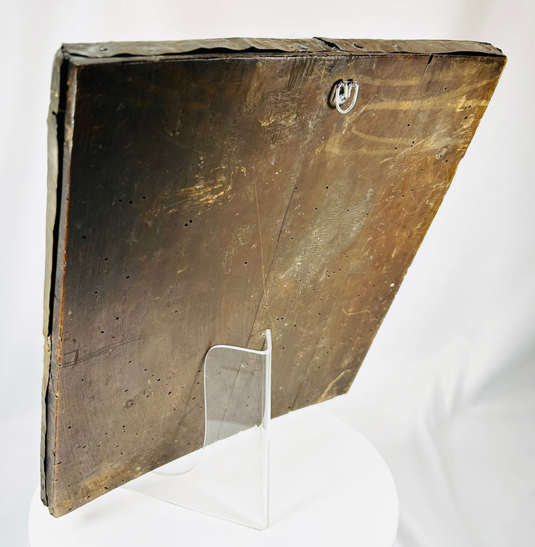 Orthodox Christian icon with detailed metal relief and traditional wooden panel backing