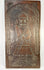 Antique European folk art carving showing bishop saint in relief with palm and laurel motifs