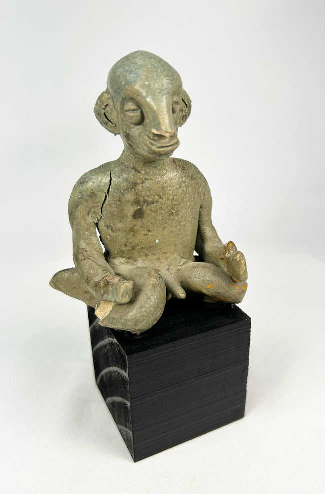 Ancient Nayarit shaft-tomb terracotta figure with crossed-leg posture and slit eyes