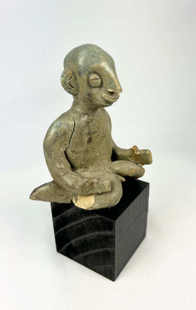 West Mexican Chinesco seated male figure with traces of red pigment and burial patina