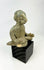 West Mexican Chinesco seated male figure with traces of red pigment and burial patina