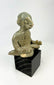 West Mexican Chinesco seated male figure with traces of red pigment and burial patina