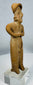 Ancient terracotta female effigy from Colima culture mounted for display on a custom lucite stand.