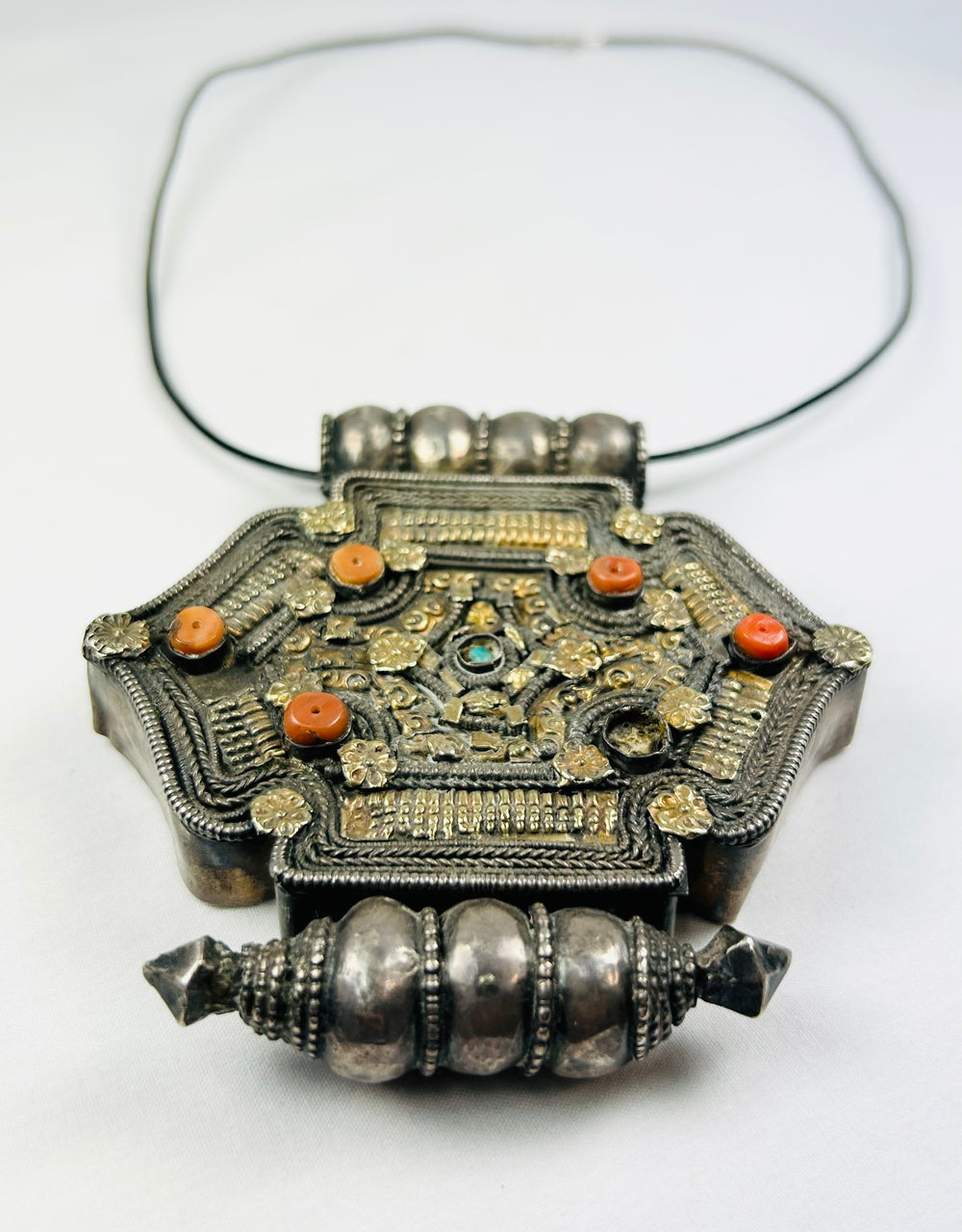 Hexagonal Tibetan-Nepalese gau pendant, hollow reliquary, coral and turquoise details, parcel-gilt design