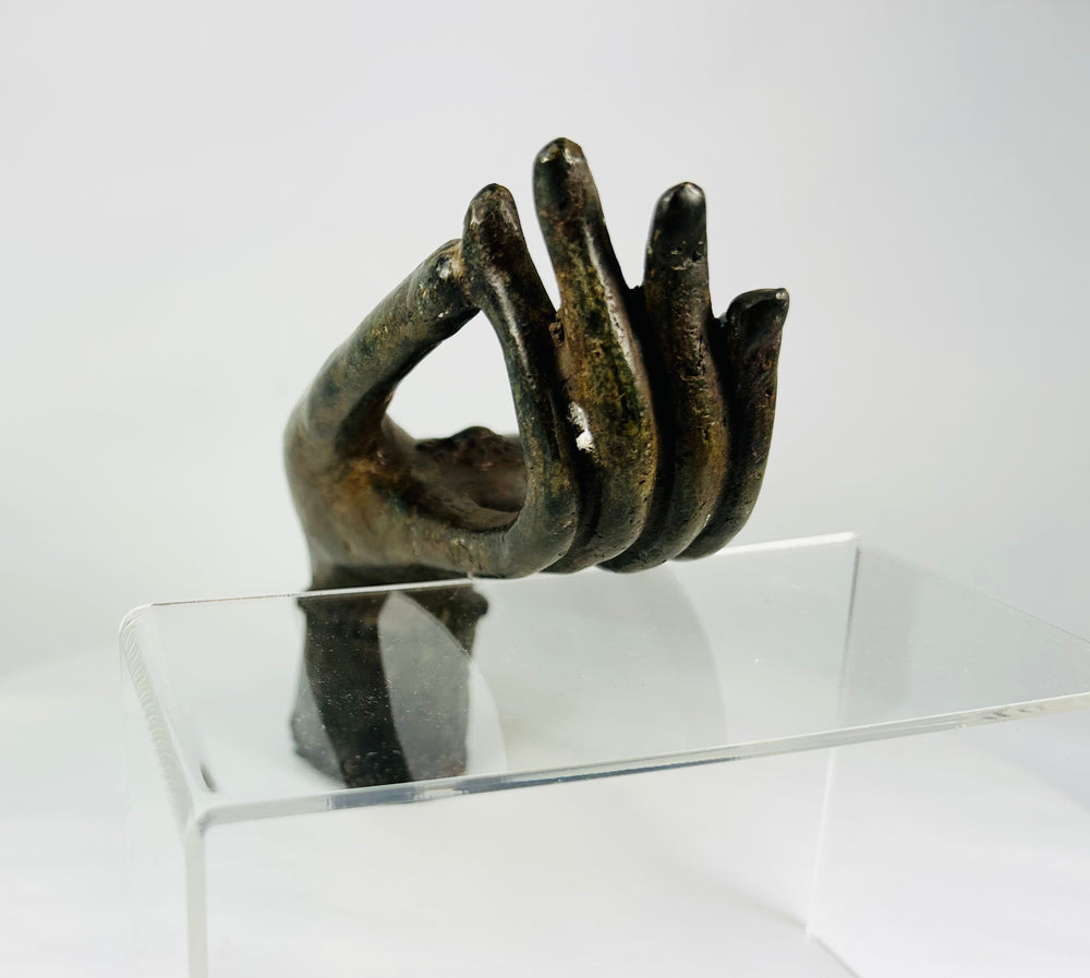 Lan Xang tradition bronze Buddha hand, fragmentary devotional sculpture with aged surface.