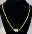 Egyptian Wedjat amulet necklace featuring a turquoise-green Eye of Horus pendant with raised protective symbolism and aged faience glaze.