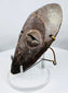 Traditional Lega wooden passport mask from Central Africa displaying a classic oval face design.