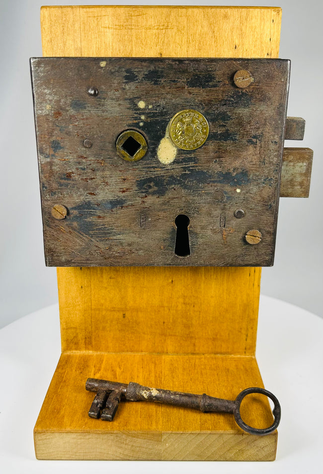 Antique lock mechanism with sliding bolt system and large iron key