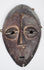 Authentic Lega passport mask featuring elongated facial form and stylized almond-shaped eyes.