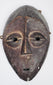 Authentic Lega passport mask featuring elongated facial form and stylized almond-shaped eyes.