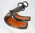 Pair of antique Japanese lacquered samurai stirrups from the Edo–Meiji period, showing red lacquered interiors and black exteriors with metal fittings, displayed on a white background.