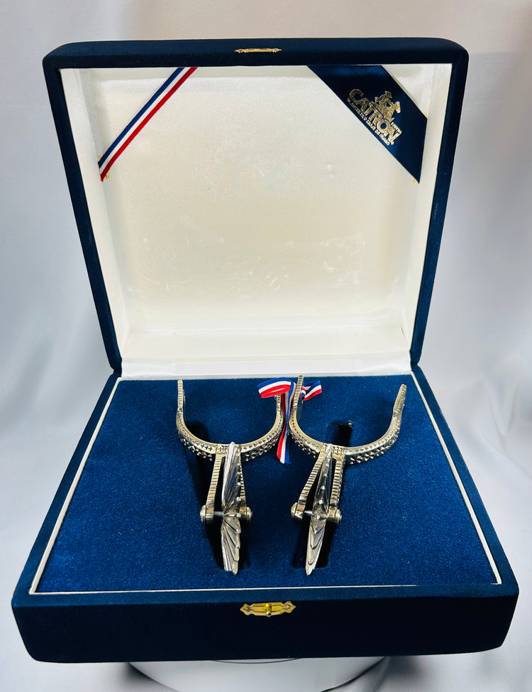 Chilean huaso spurs with rotating star rowels and engraved floral motifs