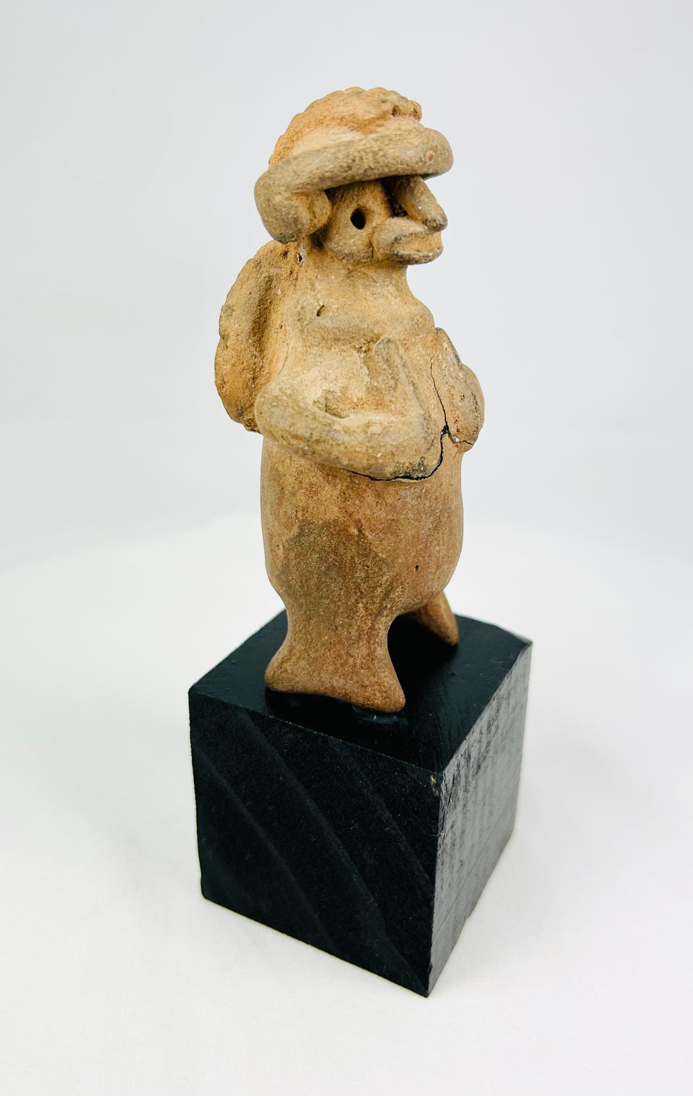 Jalisco/Nayarit Pre-Columbian terracotta warrior effigy, 100 BCE–300 CE, mounted on display base