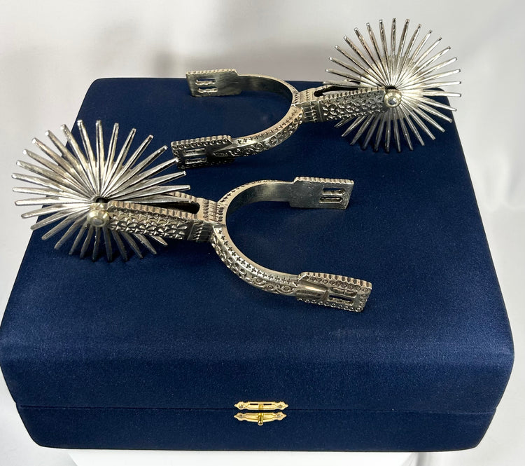 Vintage equestrian spurs from Chile with ornate metalwork and patina