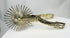 South American equestrian spurs with large rotating rowels and engraved detail