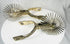 Vintage Chilean horse riding spurs with ornate metalwork and rotating rowels