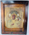 Black Madonna devotional icon with embossed metal revetment, jeweled crowns, and decorative halo motifs.