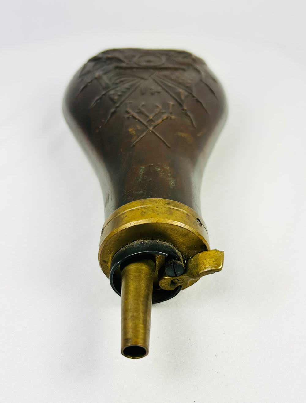 Civil War period powder flask, teardrop copper body with embossed cannon and stacked shot, crossed rifles and flags, original brass top and lever.