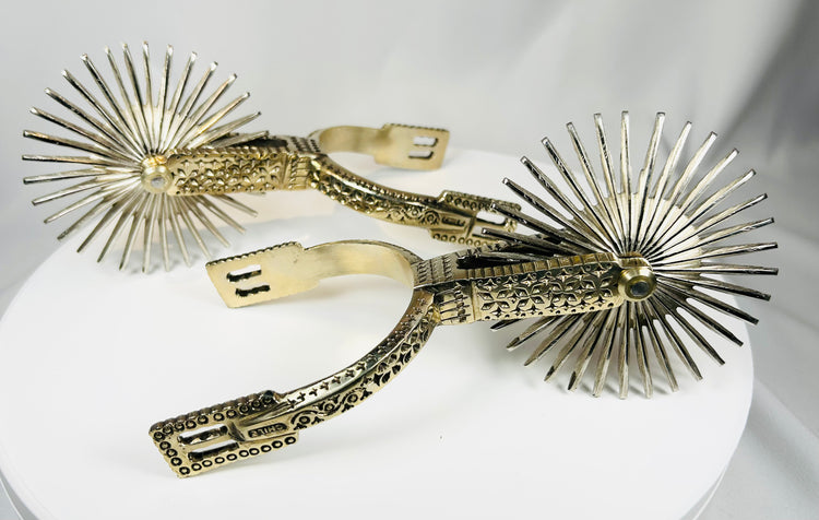 Huaso spurs from Chile with decorative engraving and multi-point star rowels