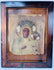 Antique icon of Our Lady of Częstochowa with painted faces, gilded details, and elaborate metal covering.