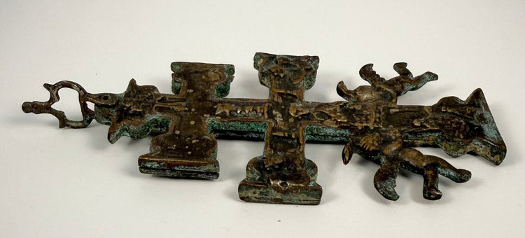 17th-century Spanish bronze Cruz de Caravaca with elaborate religious reliefs, surviving silver-coloured finish, and natural green and turquoise oxidation.