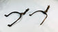 Museum-quality Saxon iron spurs with pointed rowels photographed on white
