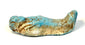 Turquoise-blue Egyptian ushabti funerary figure featuring softened facial modelling, localized glaze losses, fine cracking, and earthy-brown encrustations.