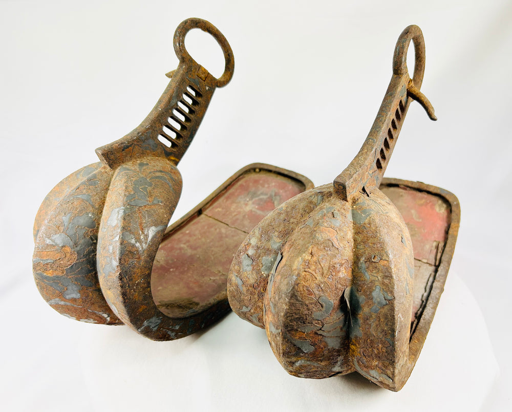 Museum-quality Japanese abumi stirrups from the Edo period reflecting samurai martial and ceremonial horse equipment.