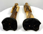 Traditional Chinese imperial-inspired bone carvings displaying decorative details along the backs of their robes, textured surfaces, and flowing sculpted fabric.