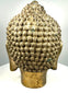 Asian Buddhist metal sculpture displaying rows of tightly arranged hair curls extending across the crown and surrounding the raised ushnisha.